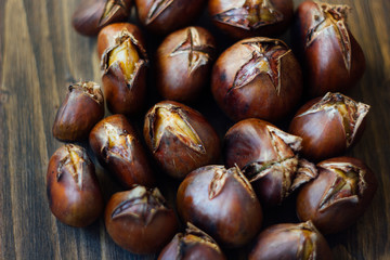 Roasted chestnuts on wooden table