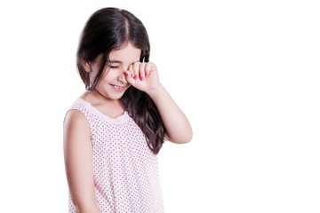 Sad crying unhappy small beautiful girl with dark hair and eyes. studio shot, isolated on white background.