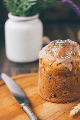 Traditional easter cake on wooden board over rustic table.