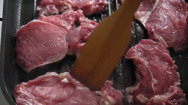 Veal steaks in a frying pan
