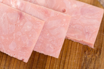 Sliced pork ham on the wooden board