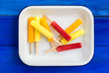 Bright Ice Popsicles made from Lemon, Pineapple, Berries