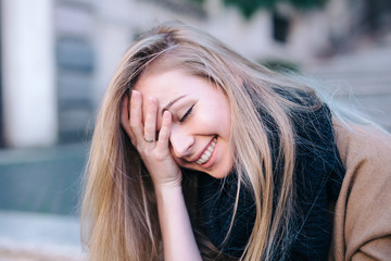 Blonde young woman smiling laughing fashion emotional