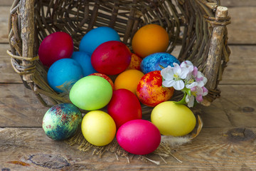Fototapeta na wymiar Happy Easter, colorful eggs in a basket