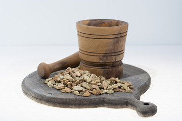 Raw Organic Cardamom Pods Ready to Use with mortar made from olive wood