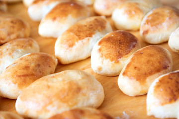 fresh delicious pies on a wooden Board (butter cakes)
