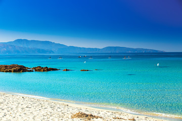 People having fun on stand up paddle board on Corsica island, France.