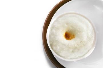 Healthy food - rice porridge with milk  on a white plate