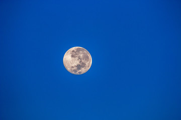 Full moon seen in the Namibian desert.