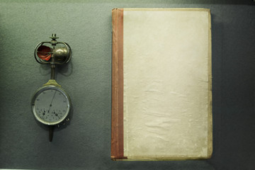 Old Anemometer and an old log for data entry on a green background.