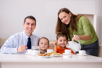 Happy family having breakfast together at home