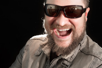 Fototapeta premium Handsome bearded man in sunglasses emotional portrait