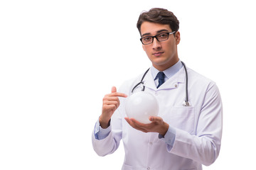 Doctor with crystal ball isolated on white background