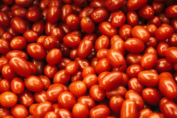 Red fresh tomatoes background. Natural local products on the farm market. Harvesting. Seasonal products. Food. Vegetables.