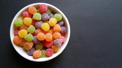 candy colored jujube on black background