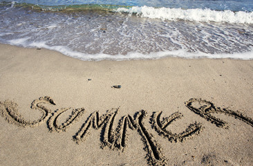 summer text written on sand