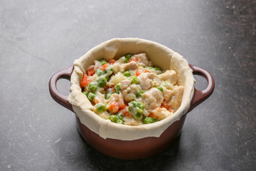 Delicious chicken pot pie on grey table