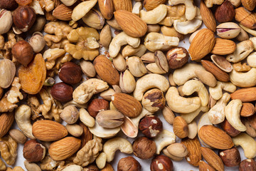 Backround from various kinds of nuts almond, walnut, hazelnut, cashew, Brazil nuts
