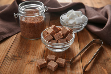 Beautiful composition with sugar on wooden background