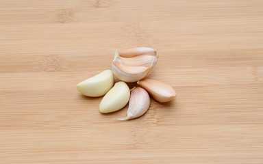 Fresh garlic on wood background
