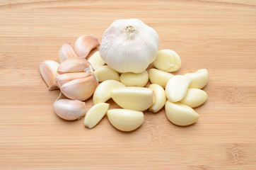 Fresh garlic on wood background