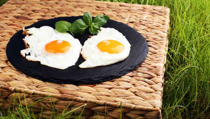 fried eggs with basil pepper and salt