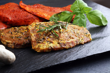 Selection of marinaded meat for grilling and sausages