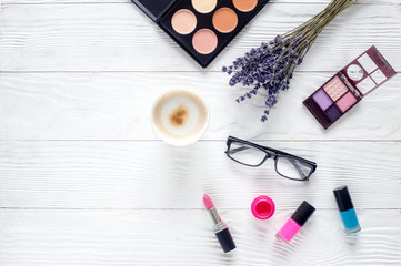 trendy woman desk with cosmetic, lavender, glasses white background top view mockup