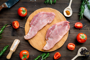 pork steak in home food concept on wooden background top view