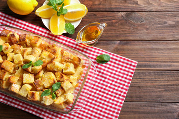 Delicious bread pudding with raisins in glass dish