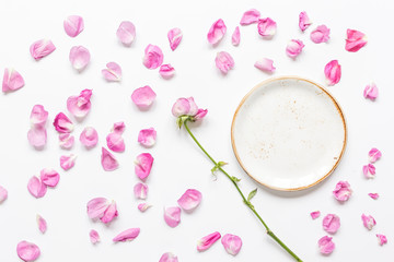 rose petals and plate flat lay on woman desk top view mockup