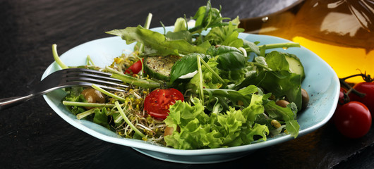 Bowl of salad on wooden table