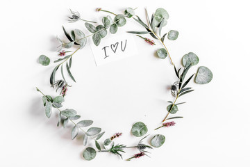 Fototapeta na wymiar floral concept with green leaves on white background top view mock-up