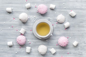 marsh-mallow pattern for trendy design in soft light wooden background top view