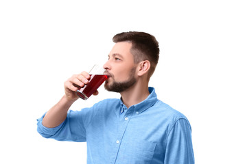 Handsome man posing with juice on white background