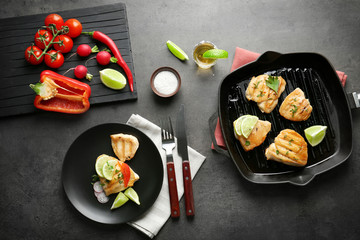 Delicious tequila lime chicken in dishware on gray background