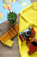 journey planning with tourist outfit on wooden table background top view