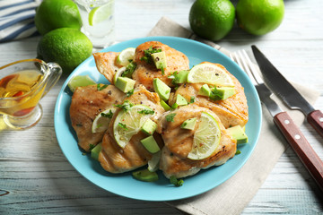 Plate of delicious tequila lime chicken on table