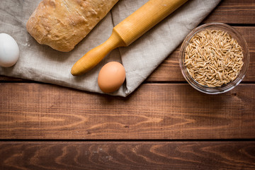 traditional bread with rolling-pin wooden table background top view space for text