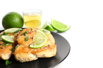 Chicken breast with tequila and lime on white background
