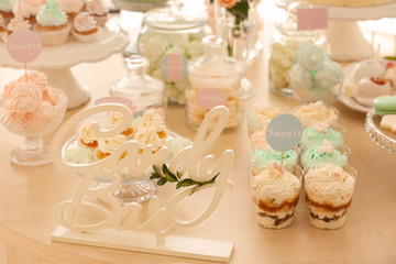 Wooden decor on table with sweets prepared for party