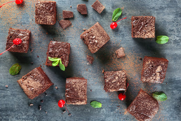 Delicious cocoa brownies on table