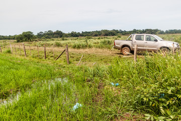 Farmer's car and a rice field near Coronel Bogado town, Paraguay