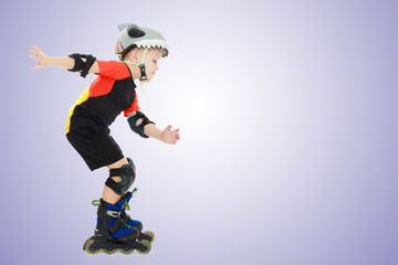 Little boy riding on the rollers.