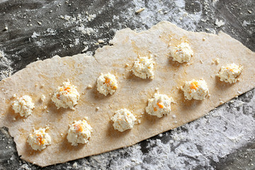 Uncooked ravioli on table