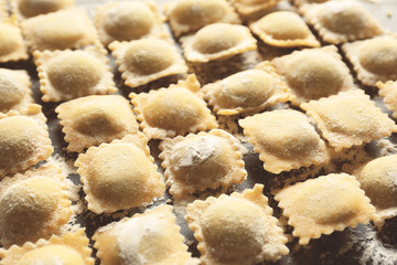 Uncooked ravioli on table, closeup