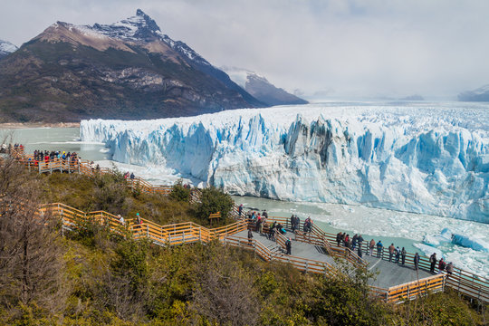 PERITO MORENO, ARGENTINA - MARCH 10, 2015: Tourists on boardwalks around Perito Moreno glacier, Patagonia, Argentina