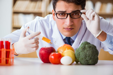 Man doctor checking the fruits and vegetables