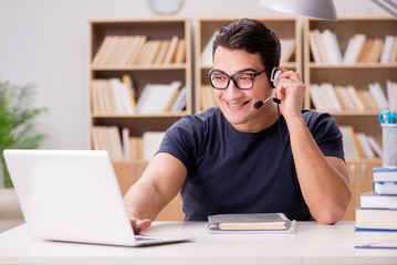 Young freelance worked working on computer