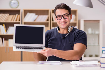 Young freelance worked working on computer